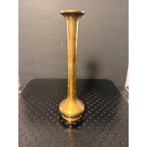 Indian-style bud vase features a long, slender stem with a flared rim